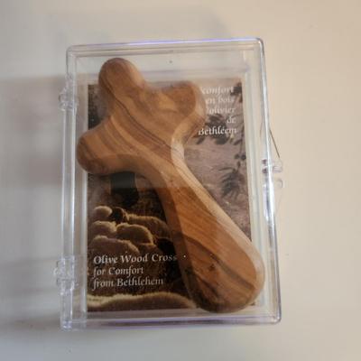 Sale Photo Thumbnail #397: This auction lot is for Three Crucifix. These handsome renditions speak volumes to those who seek. One is a quite artistic and pearlized cross, another is of Holy Land Olive Wood and the other is a nice polished wood cross.