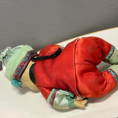 Googley eye doll and Asian doll