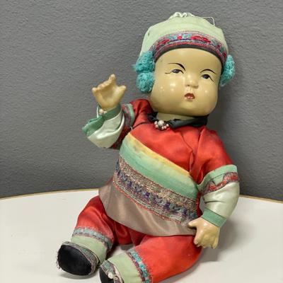 Googley eye doll and Asian doll