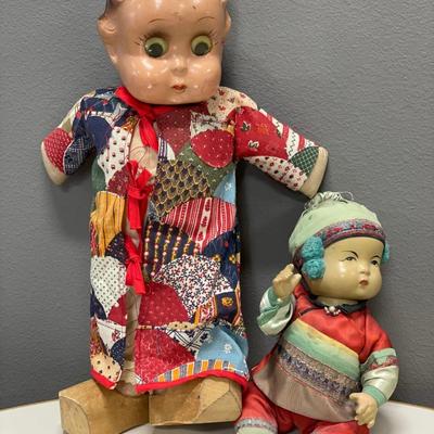 Googley eye doll and Asian doll