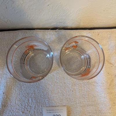 two Oklahoma State University (OSU) Cowboys logo shot or whiskey glasses.