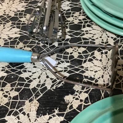 Sale Photo Thumbnail #367: You get 4 divided dinner plates, two hand mashers one red handle the other blue handle.  You also get a black handle hand mixer, and a metal cookie cutter.