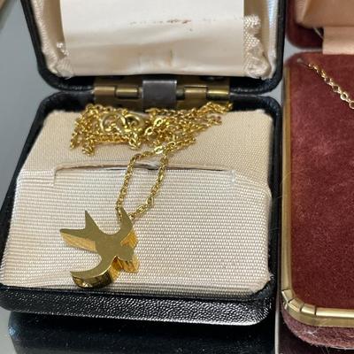 2 gold tone bird necklaces