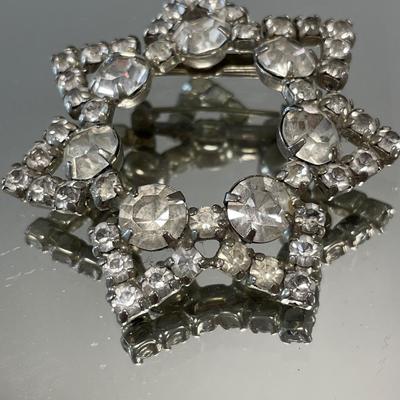 Sparkling star and moon brooches