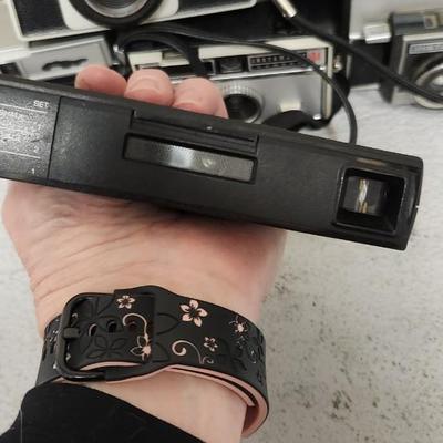 Sale Photo Thumbnail #462: Mixed lot of Instamatic type cameras. 8 total. Fits a medium flat rate box