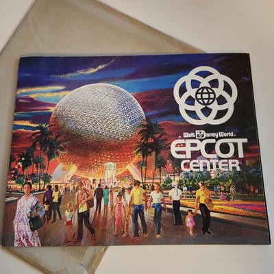 Sale Photo Thumbnail #457: This auction lot is for a Disney Epcot Center Introduction Brochure - 1982.  This brochure/booklet comes in original mailing envelope with letter from Disney's Magic Kingdom Club.  This brochure/booklet is full of color photos and drawings showing the the