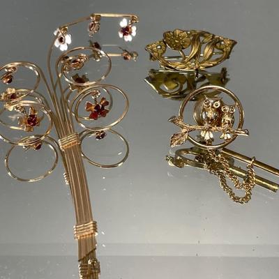 3 vintage gold tone brooches