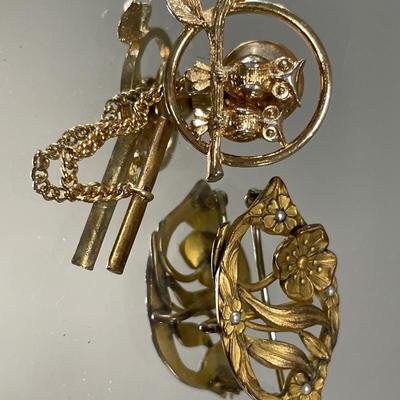 3 vintage gold tone brooches