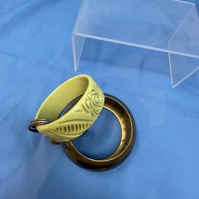 Sale Photo Thumbnail #55: 5 bracelets, very clean.  The top left one is Lucite, not Bakelte