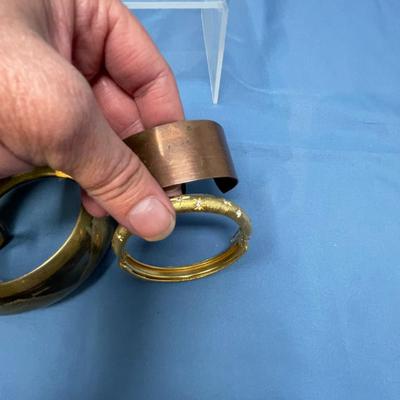 Sale Photo Thumbnail #54: 5 bracelets, very clean.  The top left one is Lucite, not Bakelte