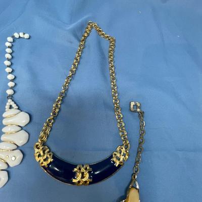Sale Photo Thumbnail #59: The white set is glass!  The rhinestone necklace has some discoloration.