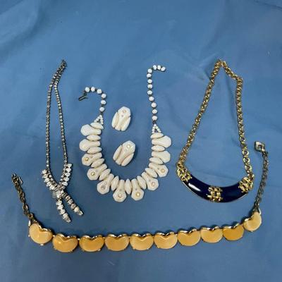 Sale Photo Thumbnail #57: The white set is glass!  The rhinestone necklace has some discoloration.