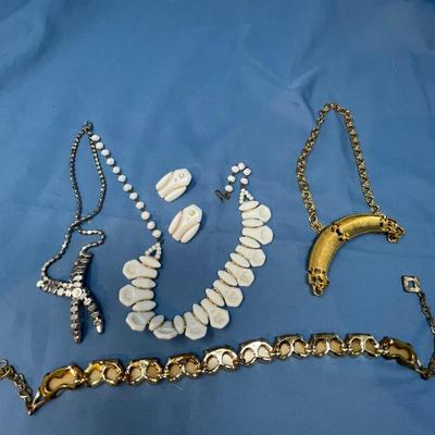 Sale Photo Thumbnail #61: The white set is glass!  The rhinestone necklace has some discoloration.