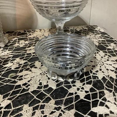 Sale Photo Thumbnail #294: You get Heiser clear glass tall vase, footed bowl, sherbet, square dish.