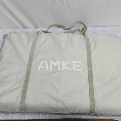 Sale Photo Thumbnail #73: AMKE baby bassinet with a stylish wooden frame and soft mesh siding for breathability and visibility. Includes an accompanying mattress and fitted sheet. Comes with a convenient carrying bag for portability. Designed for stability and easy assembly. Minim