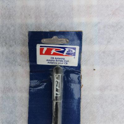 Sale Photo Thumbnail #128: TRD CB antenna set, including a sealed black, red, and blue TRD antenna (model TA0003) in its original packaging. This antenna is designed for CB (Citizen Band) radio use and includes product details and installation instructions on the packaging. Two add