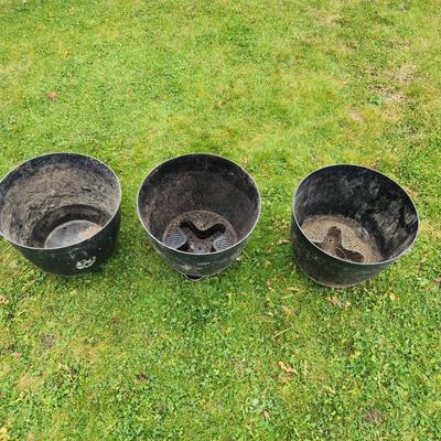Sale Photo Thumbnail #127: Three large black plastic plant pots featuring built-in drainage holes. Suitable for indoor or outdoor use. The pots show signs of previous use with minor surface wear. Approximate height is displayed in the photo with a tape measure, which indicates over