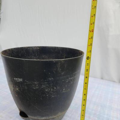 Sale Photo Thumbnail #126: Three large black plastic plant pots featuring built-in drainage holes. Suitable for indoor or outdoor use. The pots show signs of previous use with minor surface wear. Approximate height is displayed in the photo with a tape measure, which indicates over
