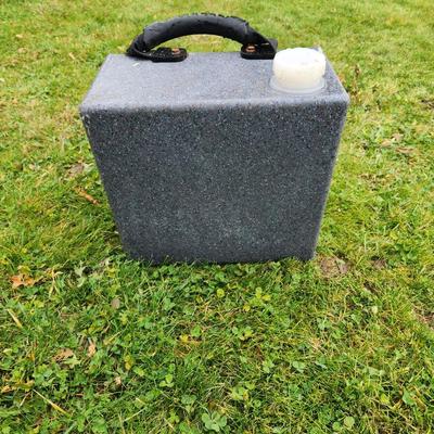 Sale Photo Thumbnail #133: WaterHole EZ-Fill water trough in gray, designed for animals. Constructed from durable, weather-resistant material. Features a sturdy black handle for portability and an integrated white cap for convenient refilling. Suitable for outdoor use in pastures o