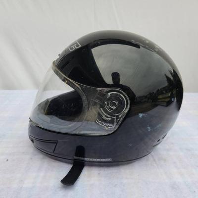 Sale Photo Thumbnail #168: HJC full-face motorcycle helmet in black color featuring a transparent visor. Shows visible signs of wear with scratches present on the surface. Equipped with an adjustable strap for a secure fit. Includes branding on the front. Condition consistent with 