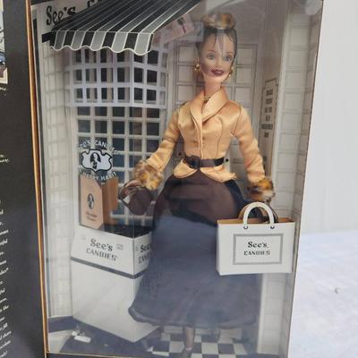 Sale Photo Thumbnail #22: Special Edition Barbie doll titled 'I Left My Heart in San Francisco,' produced in collaboration with See's Candies. The doll is presented in a themed packaging featuring classic San Francisco elements and a See's Candies storefront. Includes elegant atti