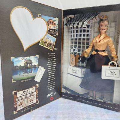 Sale Photo Thumbnail #21: Special Edition Barbie doll titled 'I Left My Heart in San Francisco,' produced in collaboration with See's Candies. The doll is presented in a themed packaging featuring classic San Francisco elements and a See's Candies storefront. Includes elegant atti