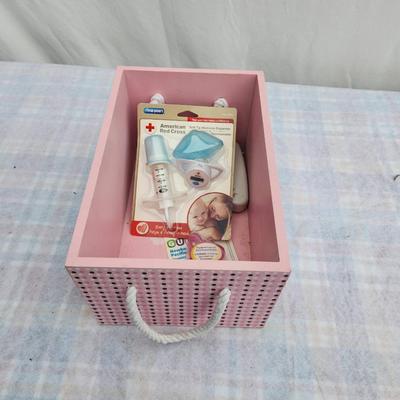 Sale Photo Thumbnail #84: Pink wooden storage box featuring a decorative 'baby' sign in white lettering and a polka dot border. Includes white rope handles for easy carrying. Comes with baby care items including an American Red Cross bulb syringe and nasal aspirator. Practical for