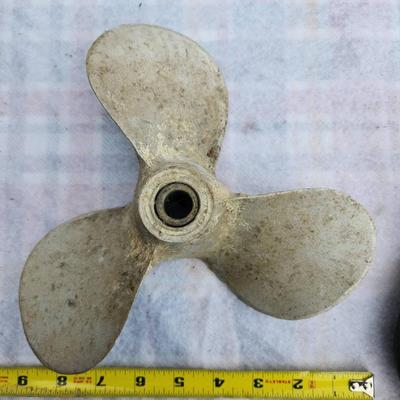 Sale Photo Thumbnail #271: One Ideal 50 ft Tuff-Grip fish tape made of S-Class non-metallic material with a steel core, featuring a durable blue housing and ergonomic hand grip. Additionally, the lot contains one 3-blade metal propeller, approximately 6 inches in diameter, suitable