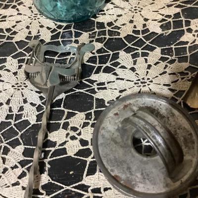 Sale Photo Thumbnail #259: You get metal serving piece, metal shoe horn, two metal door handle plates, cookie cutter, mics metal items and blue glass canning jar.