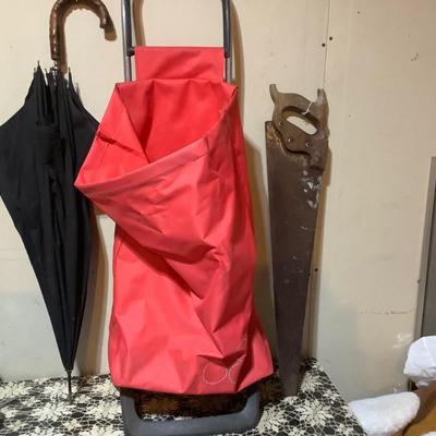 Sale Photo Thumbnail #461: You get this nice cart, a black and wood umbrella, and a vintage hand saw.