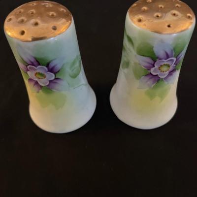 A COLLECTION OF SALT AND PEPPER SHAKERS