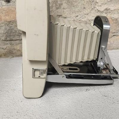 Sale Photo Thumbnail #481: Polaroid 800 in case with books and flash attachments. Fits large flat rate box