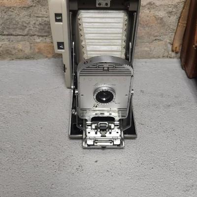 Sale Photo Thumbnail #479: Polaroid 800 in case with books and flash attachments. Fits large flat rate box