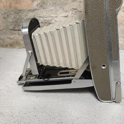 Sale Photo Thumbnail #483: Polaroid 800 in case with books and flash attachments. Fits large flat rate box