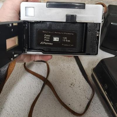 Sale Photo Thumbnail #642: Pair of Kodak Instamatic cameras. One 700 in case and one x-30 in case. The 700 has film in it. Fits medium flat rate box