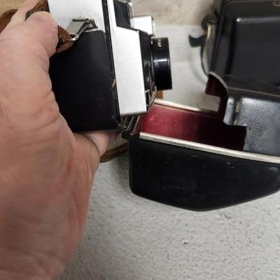 Sale Photo Thumbnail #639: Pair of Kodak Instamatic cameras. One 700 in case and one x-30 in case. The 700 has film in it. Fits medium flat rate box