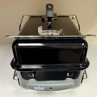 Sale Photo Thumbnail #447: This compact and lightweight grill is designed for easy transport and is suitable for camping, tailgating, and small outdoor spaces. Used, but in very clean, near-new condition.