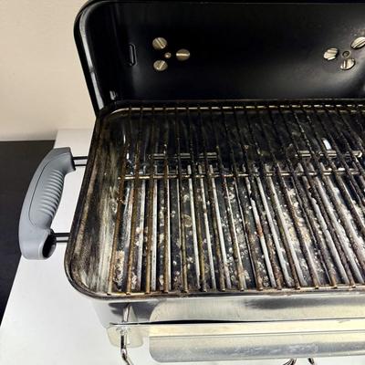 Sale Photo Thumbnail #448: This compact and lightweight grill is designed for easy transport and is suitable for camping, tailgating, and small outdoor spaces. Used, but in very clean, near-new condition.