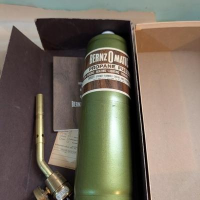 Chain saw sharpener, propane torch.