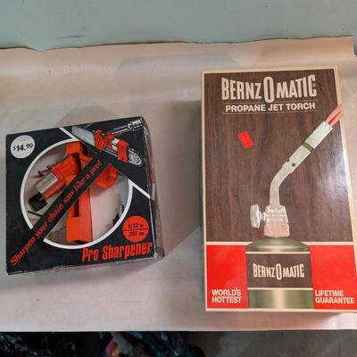 Chain saw sharpener, propane torch.