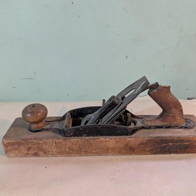 Vintage wood plane, carpentry tool.
