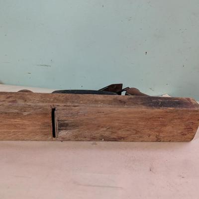 Vintage wood plane, carpentry tool.