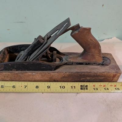 Vintage wood plane, carpentry tool.