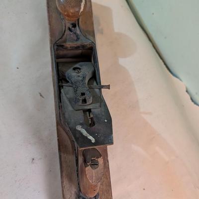 Vintage wood plane, carpentry tool.