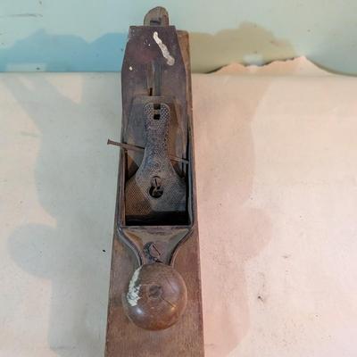 Vintage wood plane, carpentry tool.