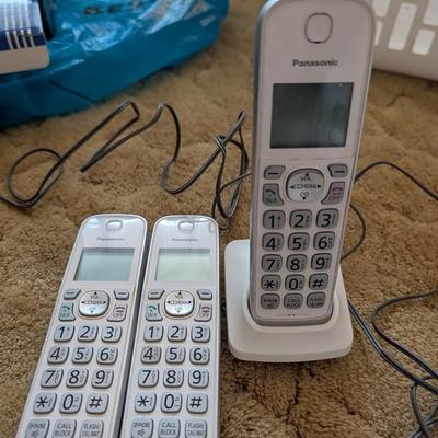 Large group of phones and bases, and answering machine.