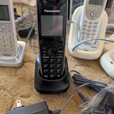 Large group of phones and bases, and answering machine.