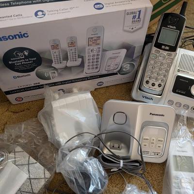 Large group of phones and bases, and answering machine.