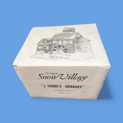 Sale Photo Thumbnail #366: Dept 56 Snow Village J Young's Granary Ceramic Figurine #5149-7  Approximately 9" x9" x 6"  Includes Light and cord.