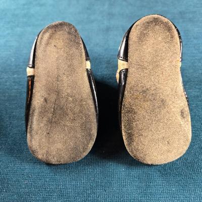 Sale Photo Thumbnail #490: This auction lot is for Victorian Baby Shoes. These are a sweet pair of Victorian Baby Shoes.  The whitish area feels like soft calf's leather and the black area is patent leather.  The soles are suede leather,  They are in very good condition for their a